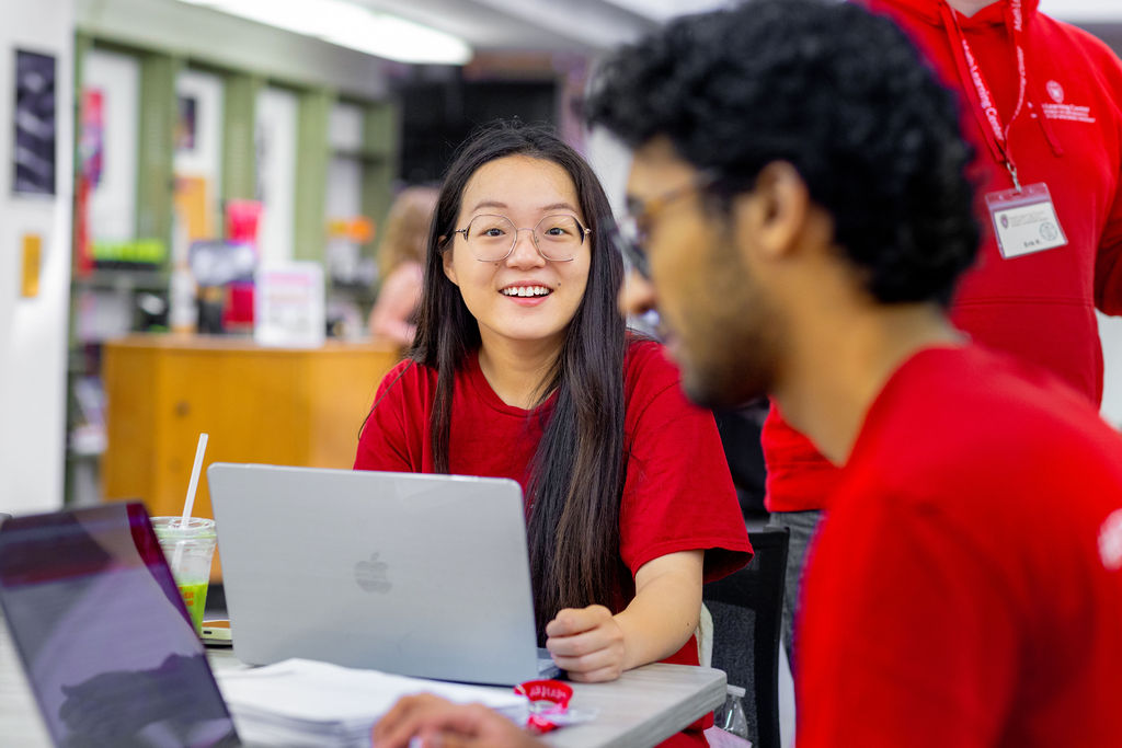 Students study together using laptops in a campus learning center.